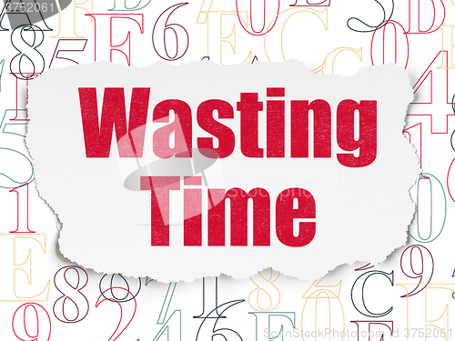Image of Time concept: Wasting Time on Torn Paper background