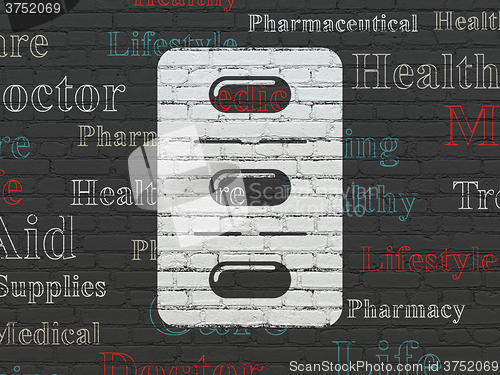 Image of Medicine concept: Pills Blister on wall background