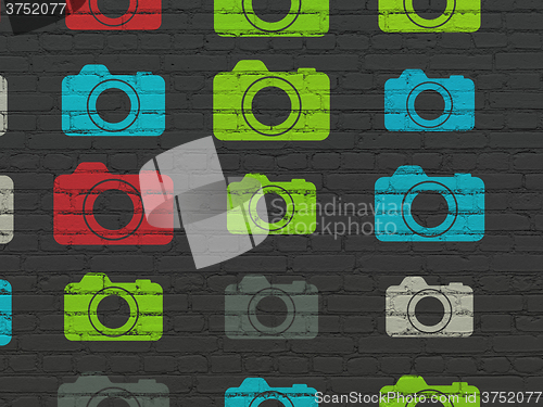 Image of Travel concept: Photo Camera icons on wall background
