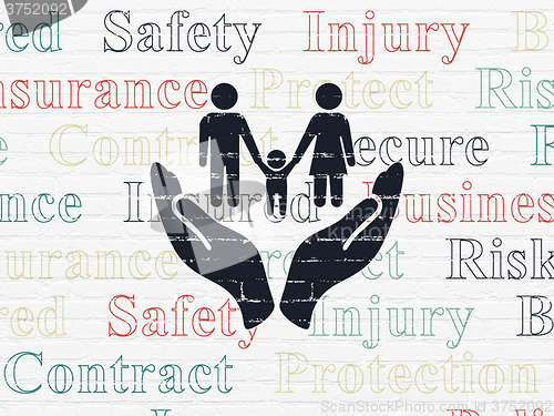 Image of Insurance concept: Family And Palm on wall background