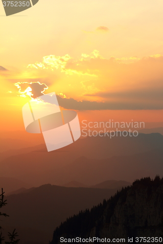 Image of orange sunset over the hills