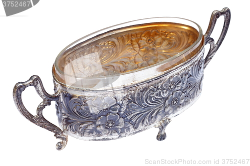 Image of ancient metallic pot over white