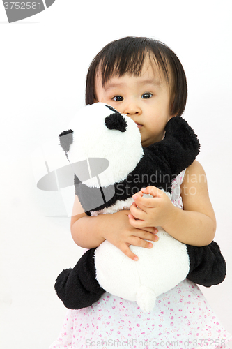 Image of Chinese Little Girl Holding Panda Toy