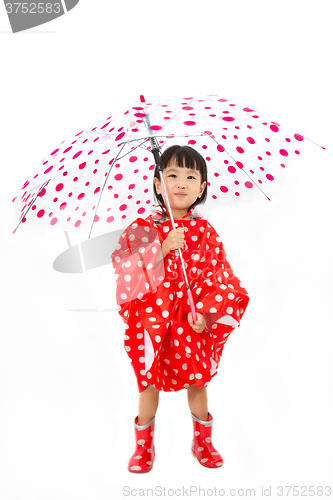 Image of Chinese Little Girl Holding umbrella with raincoat