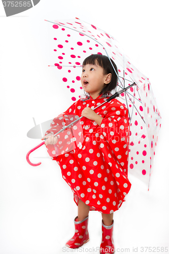 Image of Chinese Little Girl Holding umbrella with raincoat