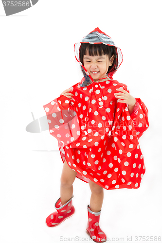 Image of Chinese Little Girl Wearing raincoat and Boots