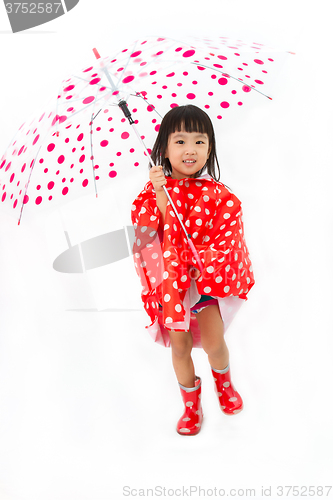 Image of Chinese Little Girl Holding umbrella with raincoat