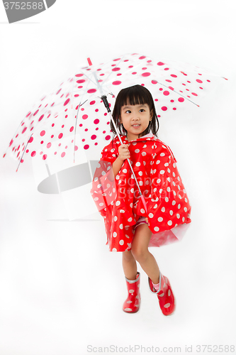 Image of Chinese Little Girl Holding umbrella with raincoat