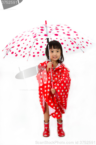 Image of Chinese Little Girl Holding umbrella with raincoat