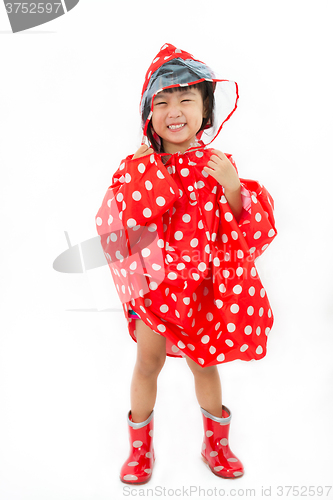 Image of Chinese Little Girl Wearing raincoat and Boots