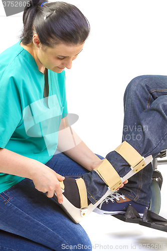 Image of Orthopedic equipment for young man in wheelchair