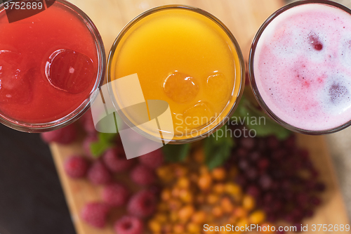 Image of fruit drink with cranberries raspberries and sea buckthorn