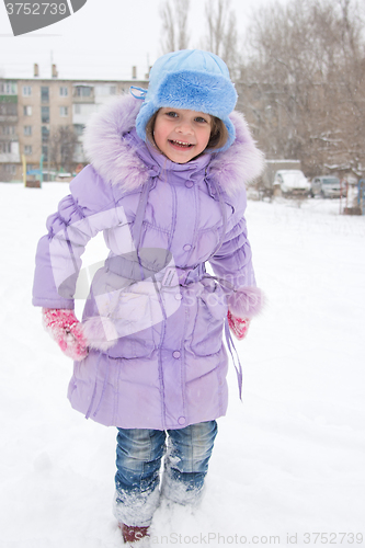 Image of Happy girl enjoys snow