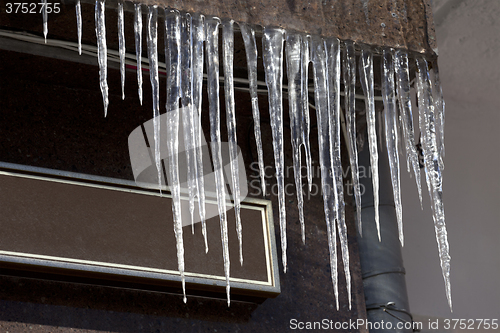 Image of Roof of house with icicles