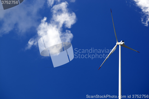 Image of Wind turbine and blue sunlight sky