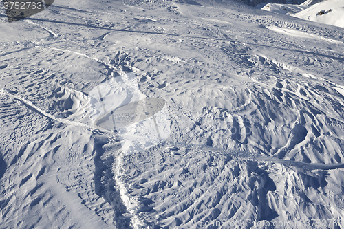 Image of Off-piste slope after snowfall at sun morning