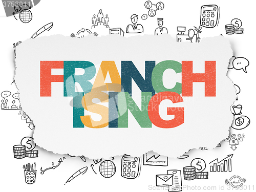 Image of Finance concept: Franchising on Torn Paper background