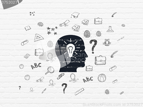 Image of Studying concept: Head With Light Bulb on wall background