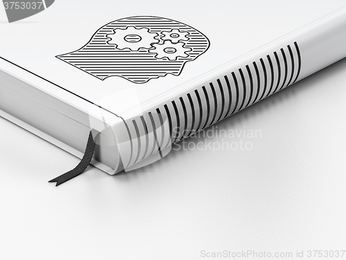 Image of Advertising concept: closed book, Head With Gears on white background