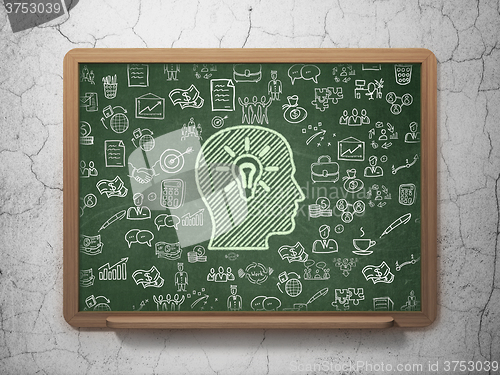 Image of Finance concept: Head With Light Bulb on School Board background
