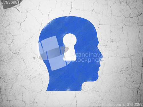 Image of Data concept: Head With Keyhole on wall background