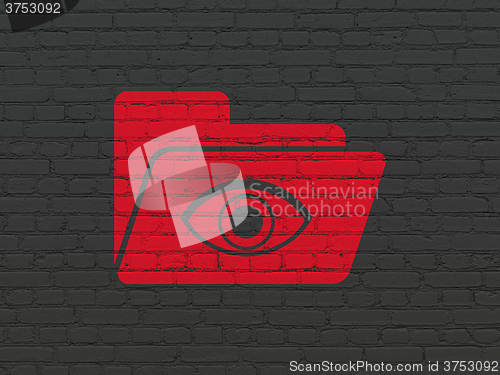 Image of Business concept: Folder With Eye on wall background