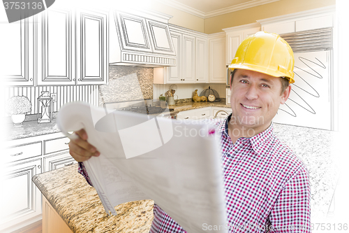 Image of Contractor Holding Blueprints Over Custom Kitchen Drawing and Ph