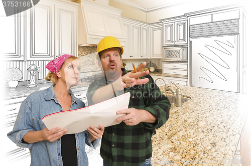 Image of Contractor Talking with Customer Over Kitchen Drawing and Photo 