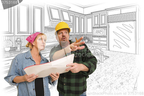 Image of Contractor Talking with Customer Over Kitchen Drawing