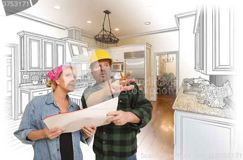 Image of Contractor Talking with Customer Over Kitchen Drawing and Photo 