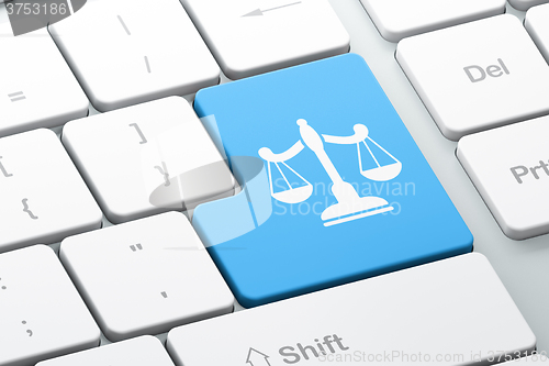 Image of Law concept: Scales on computer keyboard background