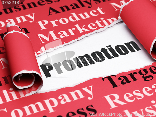Image of Marketing concept: black text Promotion under the piece of  torn paper
