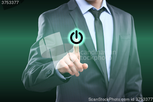 Image of Businessman pressing power button concept