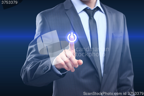 Image of Businessman pressing power button concept