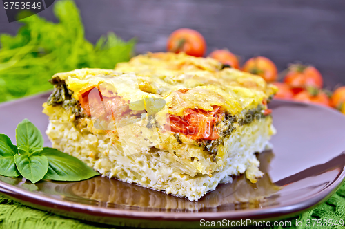 Image of Pie potato with tomato on board