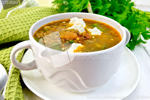 Image of Soup lentil with spinach and feta on board
