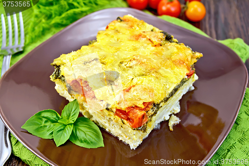 Image of Pie potato with tomato and basil on board