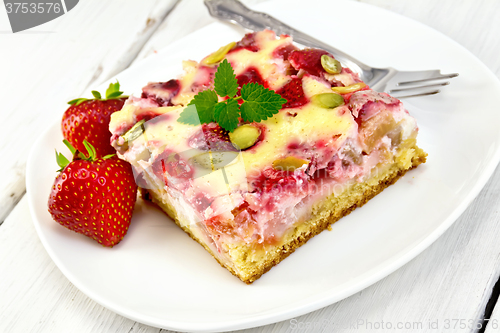 Image of Pie strawberry-rhubarb with sour cream and fork on board