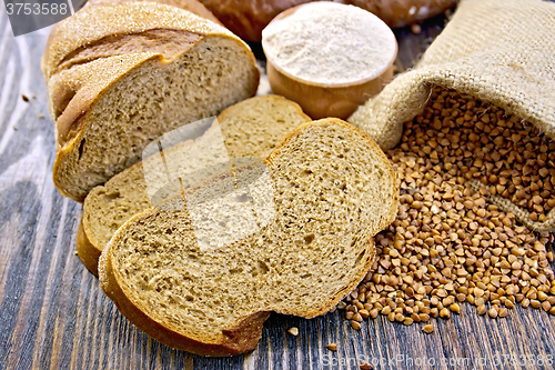 Image of Bread buckwheat with cereals and flour on board