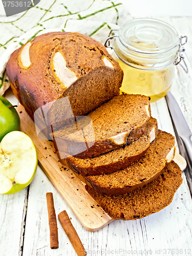 Image of Bread apple with cinnamon on light board