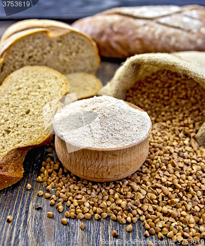 Image of Flour buckwheat in bowl with cereals and breads on board