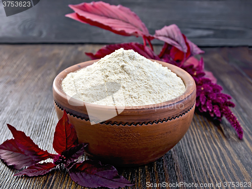 Image of Flour amaranth in clay bowl on dark board