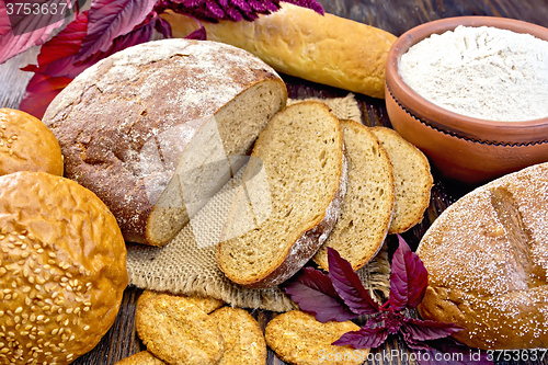 Image of Bread and biscuits amaranth with flour and flower on board