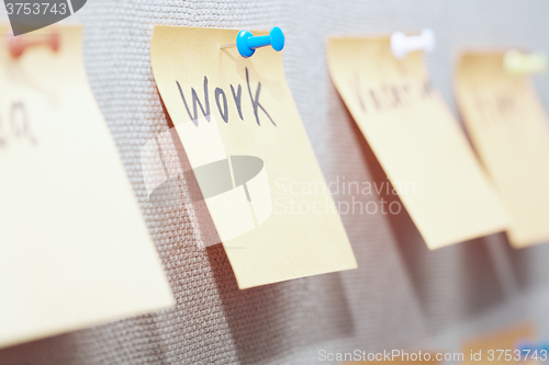 Image of Work written on a sticky note