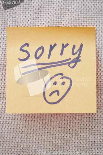 Image of Sorry written on a sticky note