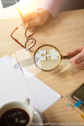 Image of Building a business success. The hands with puzzles