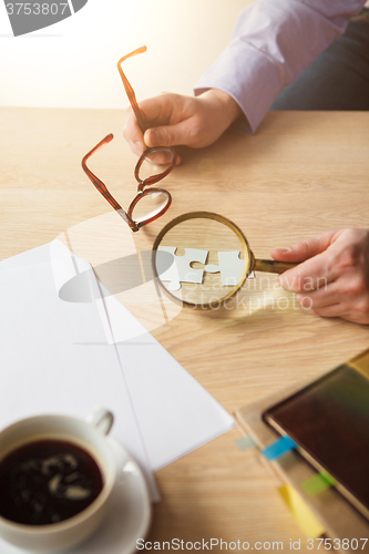 Image of Building a business success. The hands with puzzles