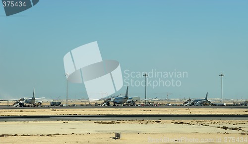 Image of Desert airport strip with airplanes