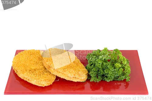 Image of Chicken Schnitzel on red plate