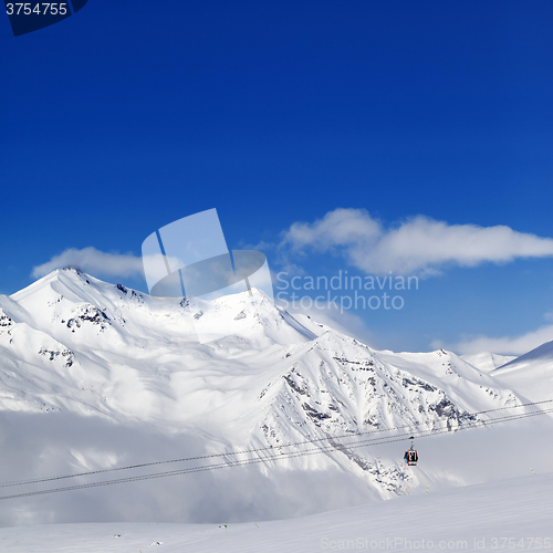 Image of Winter snowy mountains and ski slope at nice day.